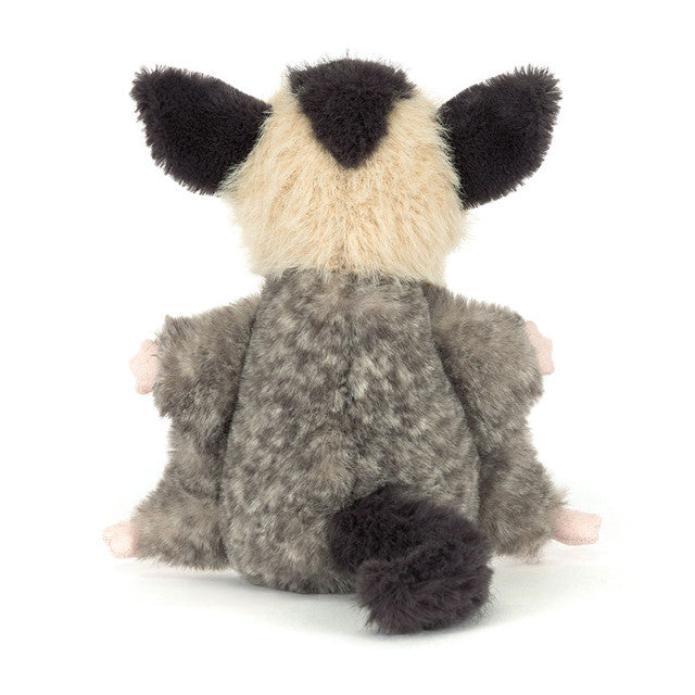 The Jellycat Lolly Sugar Glider plush toy by Jellycat features beige and gray fur, large dark ears, a fluffy tail, and tiny pink feet and hands, shown sitting with its back toward the viewer.