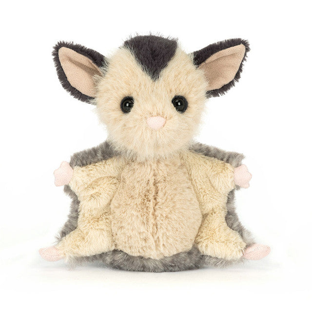 The Jellycat Lolly Sugar Glider is a plush toy by Jellycat featuring large ears, round black eyes, cream fur with gray accents, and outstretched limbs. It resembles a sugar glider and is shown against a plain white background.